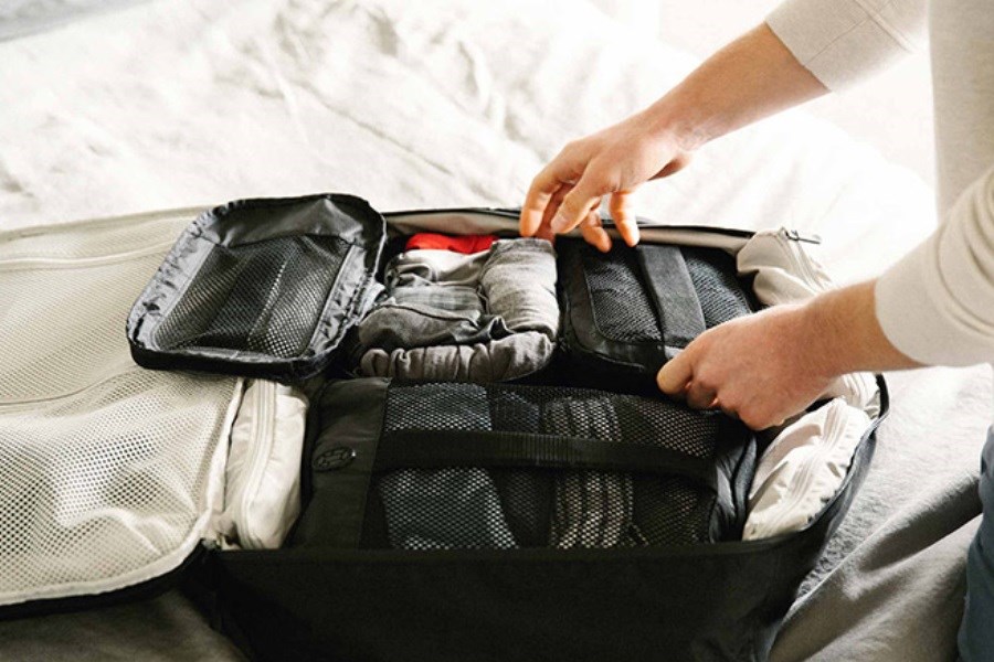 تصویر نحوه بستن چمدان برای سفری راحت تر